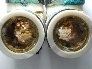As seen in the close-up view above, heavy internal deposits were observed on the interior surface of the fittings.